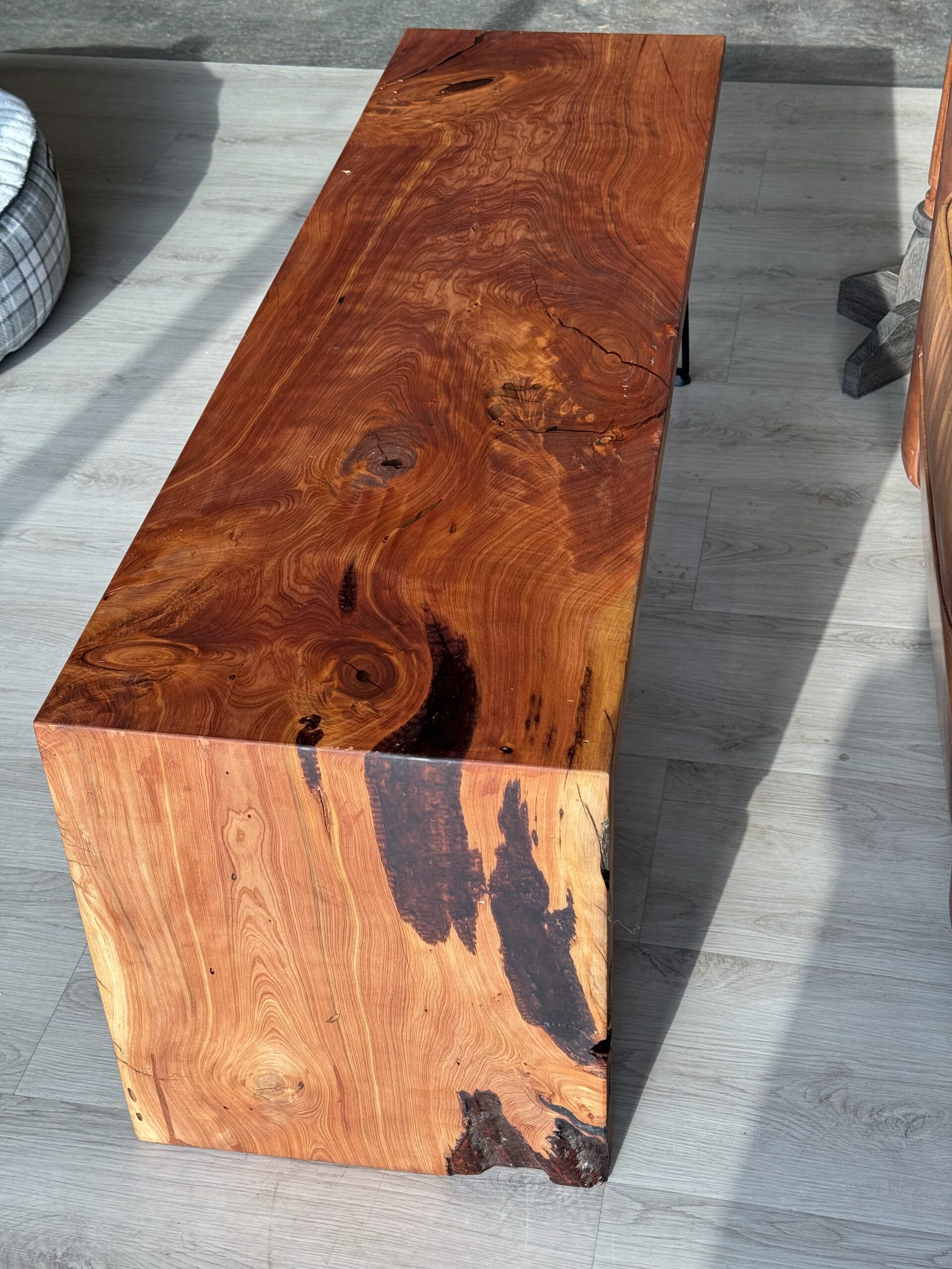 A waterfall table made with alligator juniper and finished with Rubio Mono Coat Pure.
